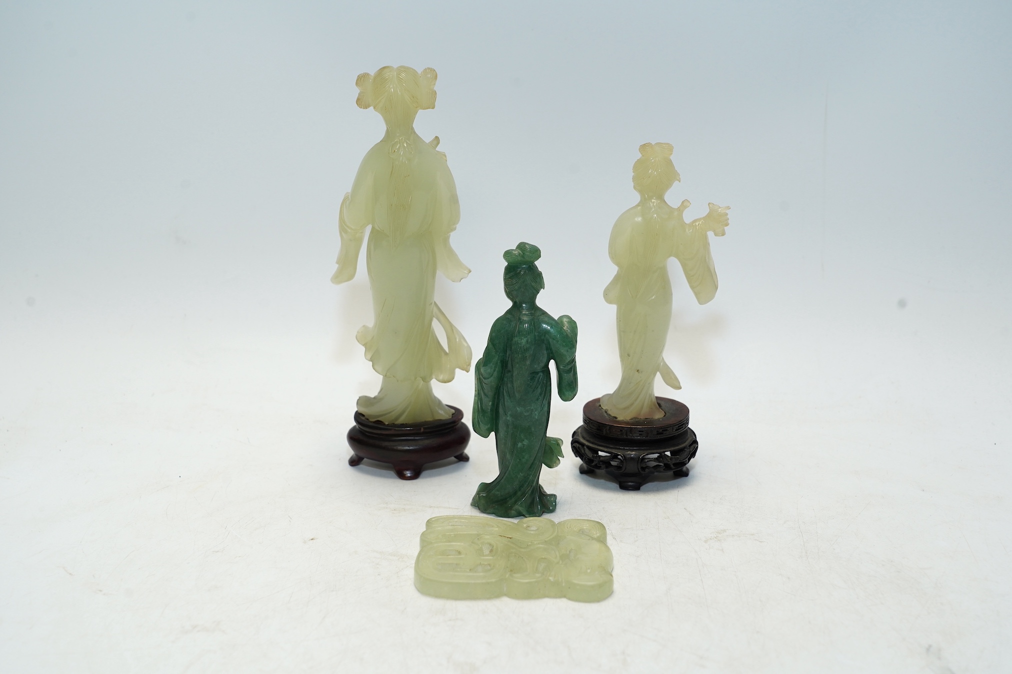 Four Chinese bowenite jade carvings, two on stands, largest 16cm high. Condition - fair to good, one figure with hand missing